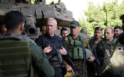 Defense Minister Yoav Gallant (center) speaks to reservist soldiers on the Lebanon border, December 17, 2023. (Ariel Hermoni/Defense Ministry) Defense Minister Yoav Gallant (center) speaks to reservist soldiers on the Lebanon border, December 17, 2023. (Ariel Hermoni/Defense Ministry)