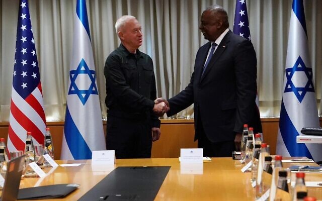 Defense Minister Yoav Gallant, left, meets with US Defense Secretary Lloyd Austin in Tel Aviv on December 18, 2023. (Ariel Hermoni/Defense Ministry)