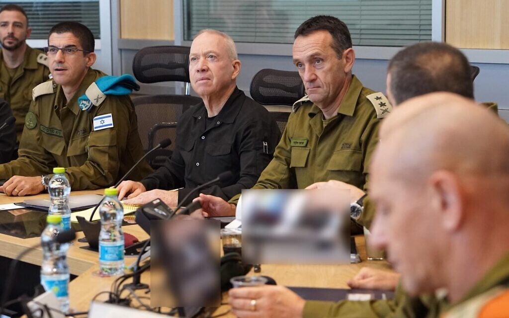 File - Defense Minister Yoav Gallant (center) meets with IDF Chief of Staff Lt. Gen. Herzi Halevi (right) and other defense officials during an assessment, December 22, 2023. (Ariel Hermoni/Defense Ministry)