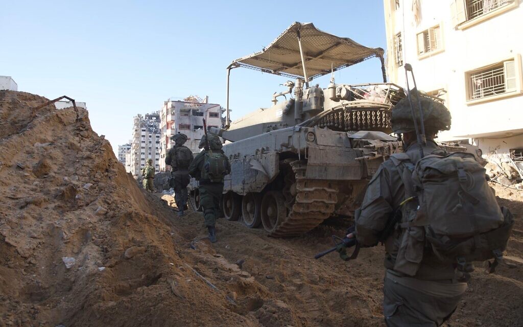 In this photo distributed by the Israel Defense Forces on December 22, 2023, Israeli troops are seen in the Gaza Strip amid the ongoing war against the Hamas terror group. (Israel Defense Forces)