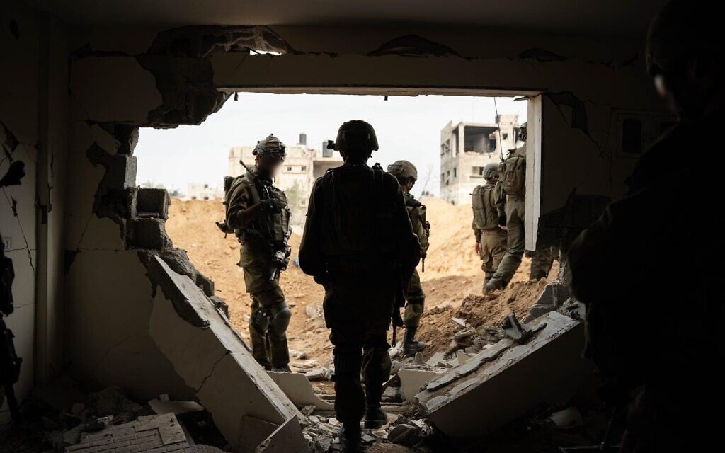 IDF troops seen operating in the Gaza Strip in this handout photo released December 23, 2023. (Israel Defense Forces)