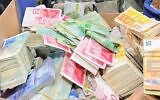 Israeli forces seized around NIS 10 million from nine money exchange branches in the West Bank overnight during a raid on companies found to be transferring funds to Hamas and the Palestinian Islamic Jihad, December 28, 2023. (Israel Defense Forces)
