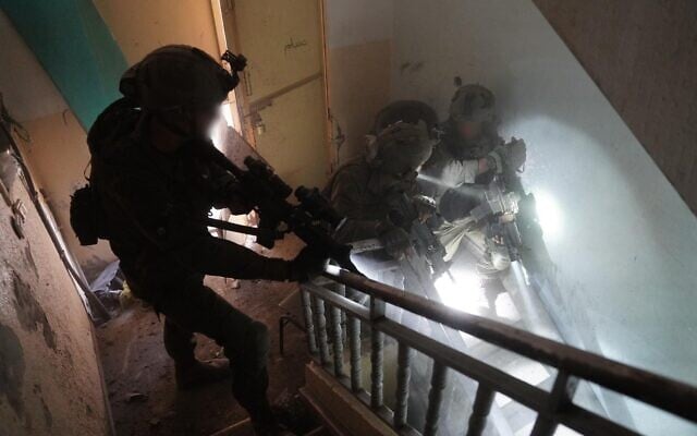 Troops of the Paratroopers Brigade operate in southern Gaza, in a handout image published by the IDF on December 31, 2023. (Israel Defense Forces) Troops of the Paratroopers Brigade operate in southern Gaza, in a handout image published by the IDF on December 31, 2023. (Israel Defense Forces)