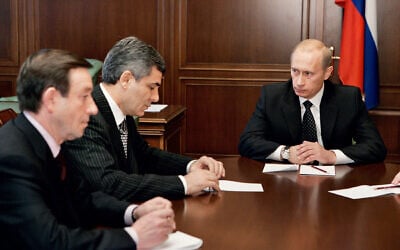 Russian President Vladimir Putin (R) holds a meeting with Kabardino-Balkaria's then-prime minister Gennady Gubin (L) and the president Arsen Kanokov (C) in Nalchik,  the capital of the republic of Kabardino-Balkaria, October 30, 2005. (Photo by ALEXEY PANOV / ITAR-TASS / AFP)