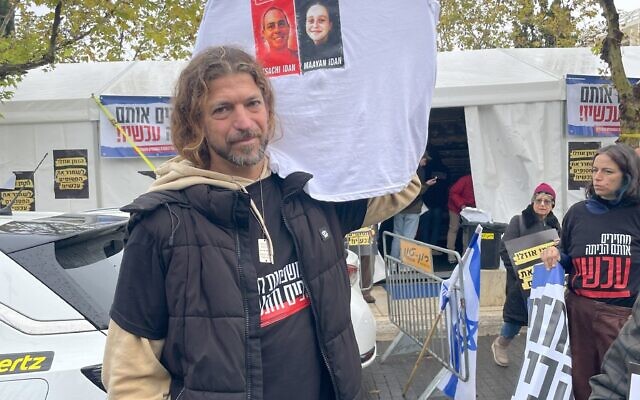 Tomer Aloni at a human chain protest for hostages outside the Knesset on December 13, 2023. (Jessica Steinberg/ Times of Israel) Tomer Aloni at a human chain protest for hostages outside the Knesset on December 13, 2023. (Jessica Steinberg/ Times of Israel)