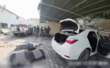 A vehicle belonging to an Israeli hostage (right) and a Hamas pickup truck (left) are seen at northern Gaza's Indonesian Hospital, in a video published by the IDF on December 25, 2023. (Israel Defense Forces)