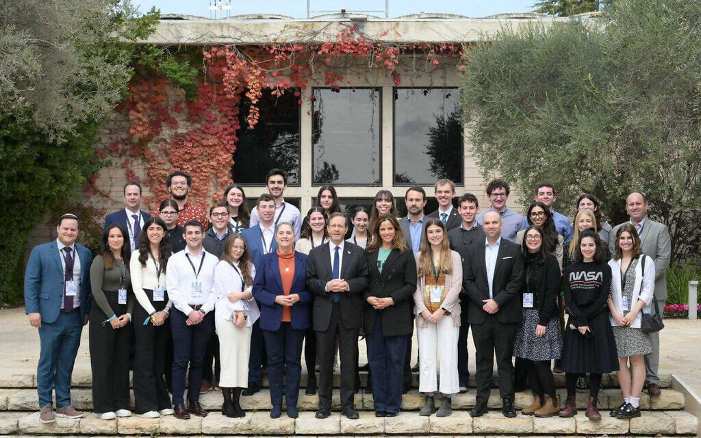 Israeli President Isaac Herzog and his wife Michal meet Noa Tishbi and students from North American universities in Jerusalem on December 28, 2023. (Amos Ben-Gershom/GPO