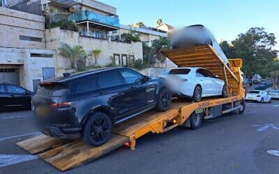 Vehicles seized as part of a police raid on a beverage company owner suspected of fraud. (Israel Police spokesperson)