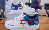 The limited edition Magen David Adom-branded Nike Air Force 1 sneakers designed by Baltimore-based artist Nathanael Elvis for a charity project the Baltimore Ravens football team supports. (Courtesy of American Friends of Magen David Adom)