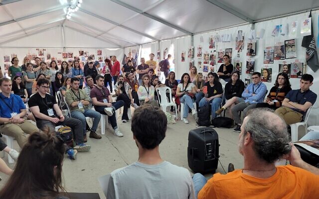 Students from North American universities listen to relatives of hostages in Gaza at Hostages Square in Tel Aviv on December 27, 2023. (Canaan Lidor/Times of Israel)