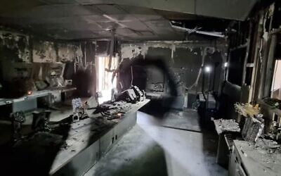 The torched command center of the Nahal Oz IDF base, overrun by Hamas terrorists on October 7, 2023, during a visit by relatives of slain lookout soldiers on December 19, 2023. (Courtesy/Eyal Eshel)