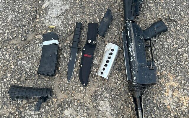 Weapons found by troops on a gunman's body in the West Bank, January 23, 2024. (Israel Defense Forces) Weapons found by troops on a gunman's body in the West Bank, January 23, 2024. (Israel Defense Forces)