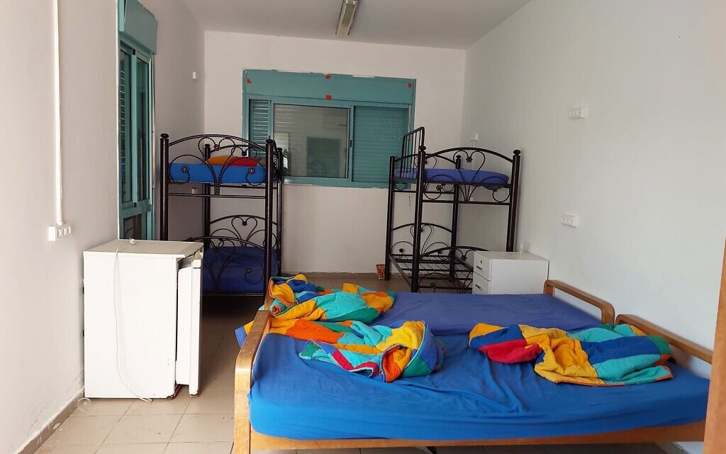 A room where Eritrean refugees stay at the Hannaton Educational Center at Kibbutz Hanaton, December 2023. (Omer Sharvit/ Zman)