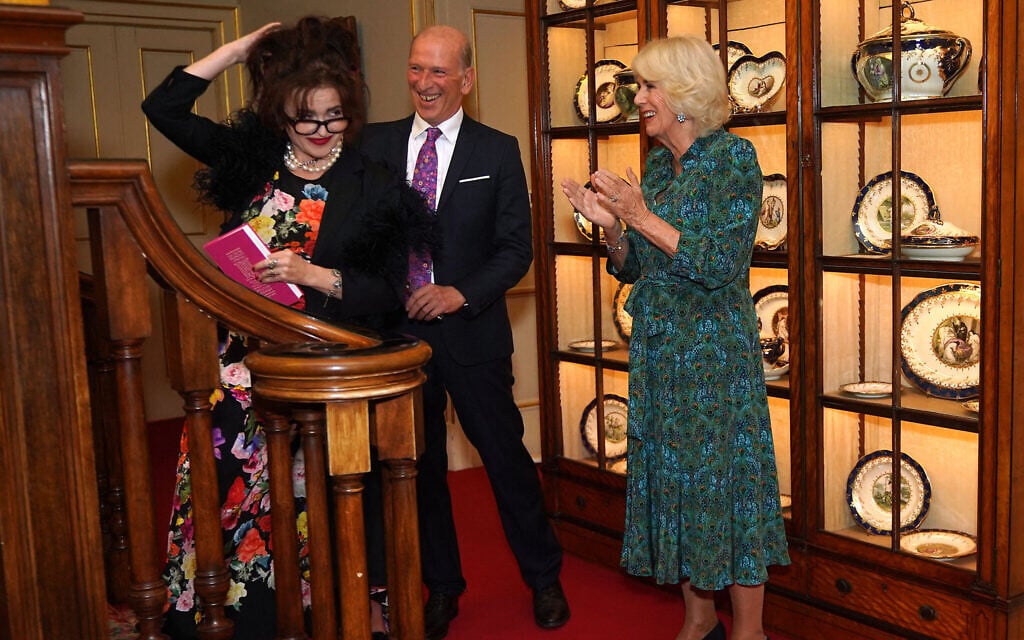 Britain's Queen Camilla, right, talks with Helena Bonham Carter, left, and Forward Arts Foundation Founder and CEO William Sieghart during a reception to celebrate 30 years of the Forward Arts Foundation at Clarence House in central London on October 11, 2023. (Photo by Yui Mok / POOL / AFP)