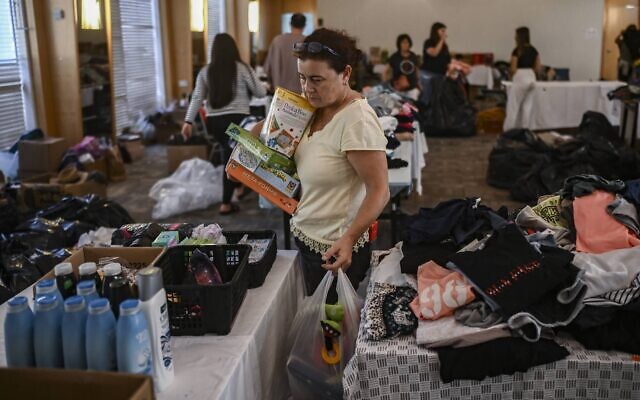 Illustrative: Residents of the Gaza border communities relocated to a hotel in Eilat. (Aris Messinis/AFP)