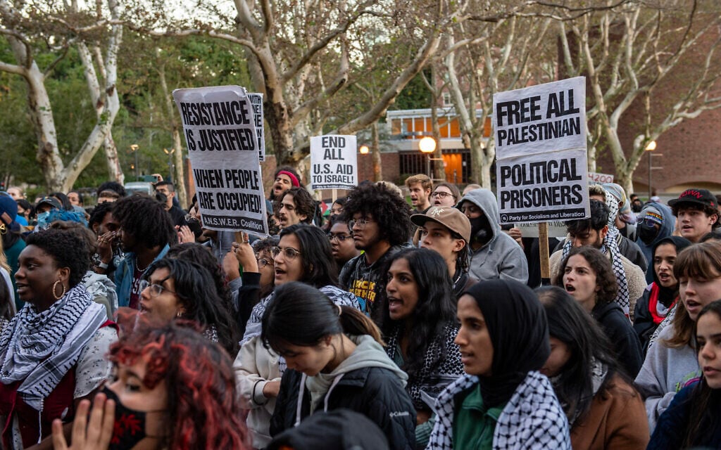 People chant and hold signs at a pro-Palestinian, anti-Israel rally at the Massachusetts Institute of Technology in Cambridge, Massachusetts, October 19, 2023. (Photo by Joseph Prezioso / AFP)
