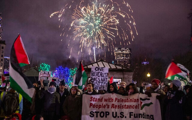 New Year's Eve fireworks go off in the sky as demonstrators protest against Israel amid the ongoing war against Hamas in Gaza, Boston, Massachusetts on December 31, 2023. (Joseph Prezioso/AFP) New Year's Eve fireworks go off in the sky as demonstrators protest against Israel amid the ongoing war against Hamas in Gaza, Boston, Massachusetts on December 31, 2023. (Joseph Prezioso/AFP)