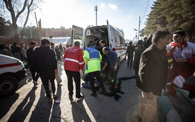 Iranian emergency services arrive at the site where two explosions in quick succession struck a crowd marking the anniversary of the 2020 killing of Guards general Qasem Soleimani, near the Saheb al-Zaman Mosque in the southern Iranian city of Kerman on January 3, 2024. (MEHR NEWS / AFP)