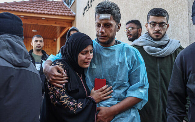 Relatives of Palestinians said killed during Israeli strikes, pictured at the European hospital in Khan Yunis in the southern Gaza Strip, on January 6, 2024. (AFP) Relatives of Palestinians said killed during Israeli strikes, pictured at the European hospital in Khan Yunis in the southern Gaza Strip, on January 6, 2024. (AFP)