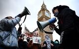 Pro-Palestinian, anti-Israel protesters chant slogans with loudspeakers in front of Big Ben at the Palace of Westminster, home to the Houses of Parliament, in central London on January 6, 2024, during a demonstration calling for a ceasefire in the war in Gaza (HENRY NICHOLLS / AFP)