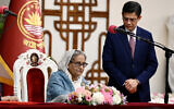 Bangladesh Prime Minister Sheikh Hasina signs documents after being sworn in for a fifth term at the Presidential Palace in Dhaka on January 11, 2024. (Munir Uz Zaman/AFP)