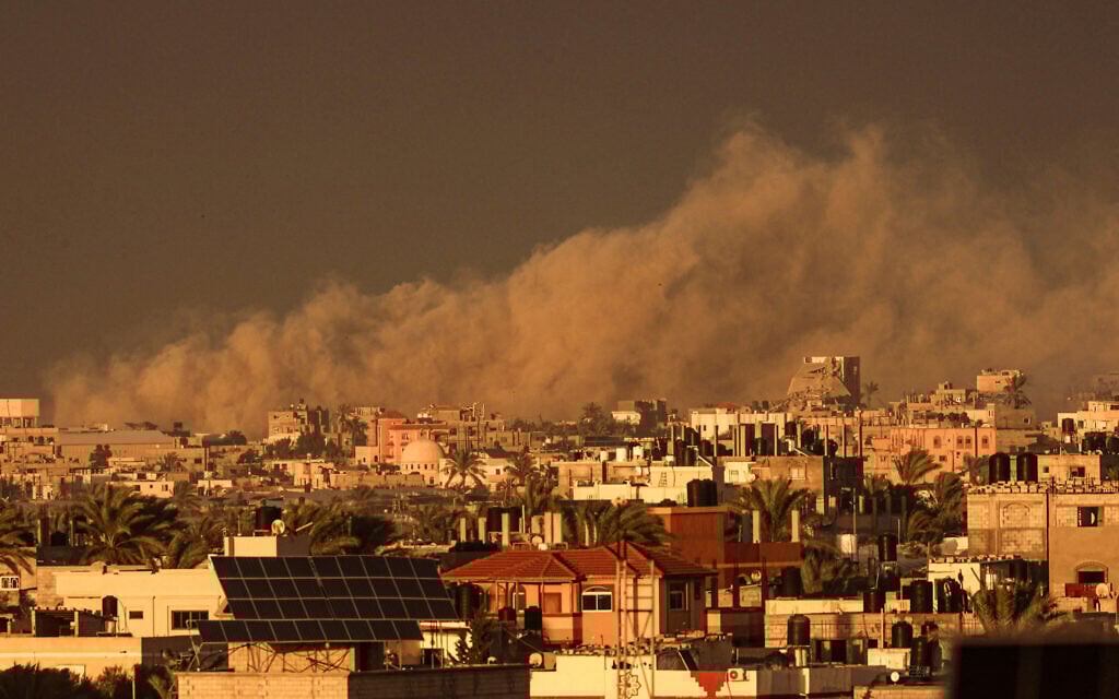 A picture taken from Rafah shows smoke billowing over Khan Younis in the southern Gaza Strip during an IDF strike on January 11, 2024. (AFP)