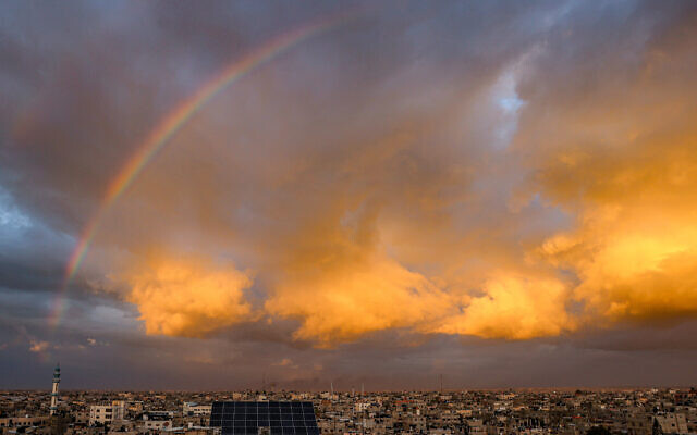 A picture taken from Rafah shows a rainbow over the southern Gaza Strip on January 11, 2024, amid ongoing battles between Israel and Palestinian Hamas terrorists in the Gaza Strip. (Photo by AFP)