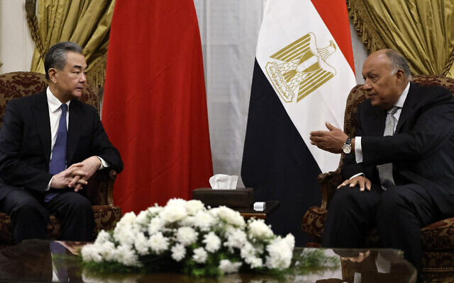 Egyptian Foreign Minister Sameh Shoukry meets with China's Foreign Minister Wang Yi at al-Tahrir Palace in the center of the Egyptian capital Cairo on January 14, 2024. (Khaled Desouki/ AFP)