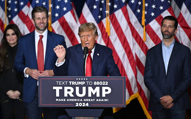 Former US president and Republican presidential hopeful Donald Trump, with sons Eric (2nd L) and Donald (R), speaks at a watch party during the 2024 Iowa Republican presidential caucuses in Des Moines, Iowa, on January 15, 2024. (Photo by Jim WATSON / AFP) Former US president and Republican presidential hopeful Donald Trump, with sons Eric (2nd L) and Donald (R), speaks at a watch party during the 2024 Iowa Republican presidential caucuses in Des Moines, Iowa, on January 15, 2024. (Photo by Jim WATSON / AFP)