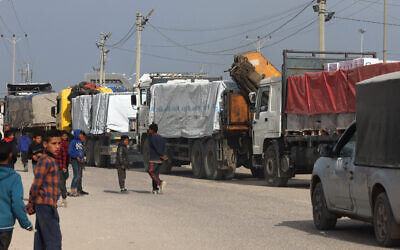 Trucks carrying humanitarian aid enter Rafah in the southern Gaza Strip after crossing the terminal border from Egypt, on January 17, 2024, during the ongoing war between Israel and the Palestinian terror group Hamas. (AFP)