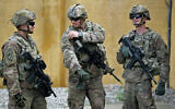 File: US army soldiers, part of the US-led coalition against the Islamic State (IS) group, walk around at the K1 Air Base northwest of Kirkuk in northern Iraq before a planned US pullout on March 29, 2020. (Ahmad Al-Rubaye/AFP)