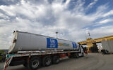 A United Nations Relief and Works Agency for Palestine Refugees (UNRWA) fuel truck arrives at the Egyptian side of the Rafah border crossing with the Gaza Strip on November 22, 2023. (Khaled Desouki/ AFP)