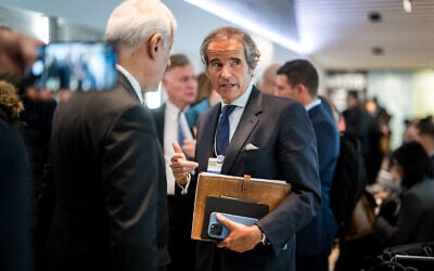 International Atomic Energy Agency (IAEA) Director General Rafael Grossi (C) stands at the Congress Center, during the World Economic Forum (WEF) annual meeting in Davos, on January 16, 2024. (Fabrice Coffrini/AFP)