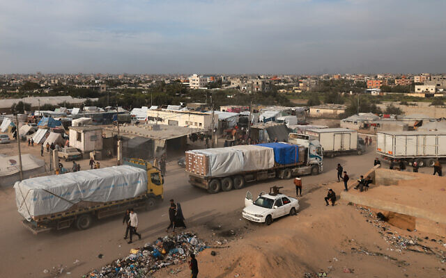 Trucks carrying humanitarian aid enter Rafah in the southern Gaza Strip after crossing the terminal border from Egypt, on January 17, 2024. (AFP)