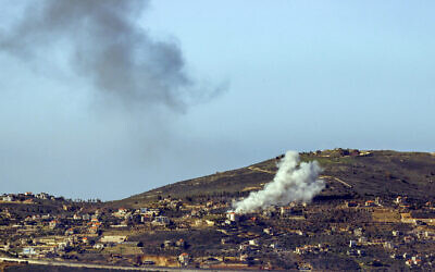 Smoke billowing over the Lebanese village of Odaisseh during Israeli strikes, January 20, 2024. (jalaa marey / AFP)