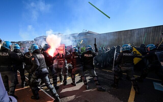 Demonstrators clash with riot police during a protest against the presence of an Israeli pavillion at Vicenzaoro, the largest show in Europe for the gold and jewelry industry, at Fiera Vicenza in Vicenza, on January 20, 2024. (Piero Cruciatti/AFP)