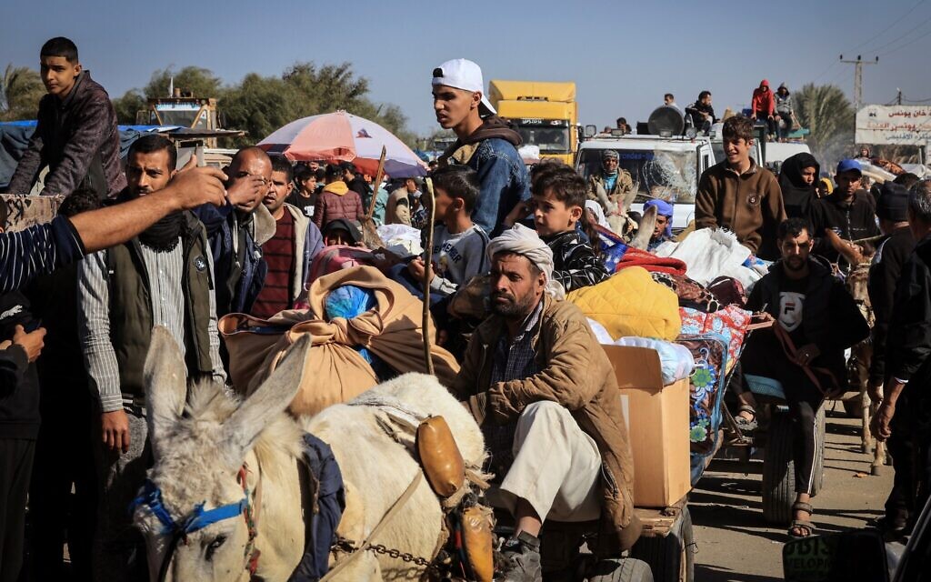 This photograph taken on January 22, 2024, on the southern outskirts of Khan Younis, in the southern Gaza Strip, shows Palestinian families fleeing the city (AFP)