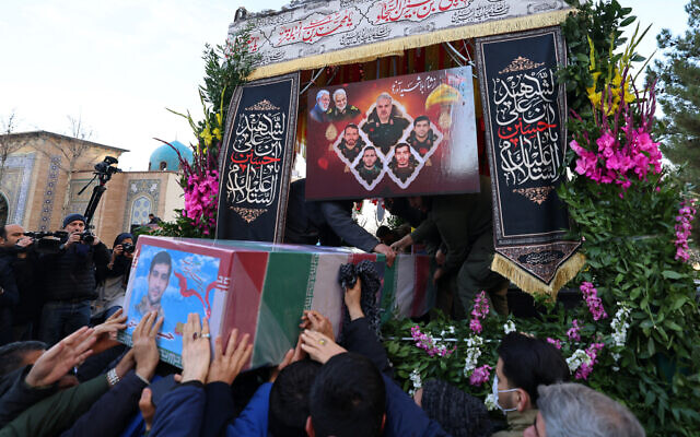 Mourners carry the casket of Revolutionary Guard Corps (IRGC) member, Hossein Mohammadi, killed in Damascus in a strike blamed on Israel on January 20, in the Iranian capital Tehran on January 22, 2024. (Photo by ATTA KENARE / AFP) Mourners carry the casket of Revolutionary Guard Corps (IRGC) member, Hossein Mohammadi, killed in Damascus in a strike blamed on Israel on January 20, in the Iranian capital Tehran on January 22, 2024. (Photo by ATTA KENARE / AFP)