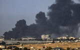 A picture taken from Rafah shows smoke billowing over Khan Younis in the southern Gaza Strip during Israeli bombardment on January 22, 2024, amid ongoing battles between Israel and Hamas. (AFP)