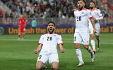 Palestinian forward Zaid Qunbar celebrates scoring his team's second goal during the Qatar 2023 AFC Asian Cup Group C soccer match against Hong Kong at the Abdullah bin Khalifa Stadium in Doha on January 23, 2024. (Giuseppe Cacade/AFP)