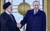 Turkish President Recep Tayyip Erdogan (R) shakes hands with Iranian President Ebrahim Raisi (L) during a welcoming ceremony in Ankara, on January 24, 2024. (Adem Altan/AFP)
