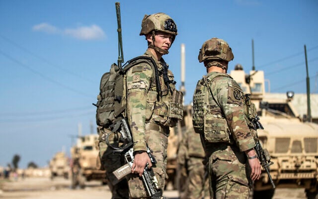 US soldiers patrol an area in the town of Tal Hamis, southeast of the city of Qameshli in Syria's northeastern Hasakeh governorate, on January 24, 2024. (Delil SOULEIMAN / AFP) US soldiers patrol an area in the town of Tal Hamis, southeast of the city of Qameshli in Syria's northeastern Hasakeh governorate, on January 24, 2024. (Delil SOULEIMAN / AFP)