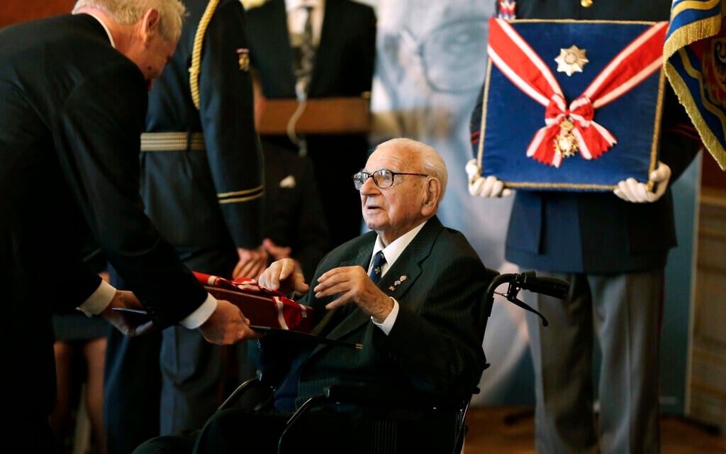 Then-Czech president Milos Zeman decorates Nicholas Winton, center, with the Czech Republic's highest decoration, The Order of the White Lion in Prague, October 28, 2014. (AP Photo/Petr David Josek, File)