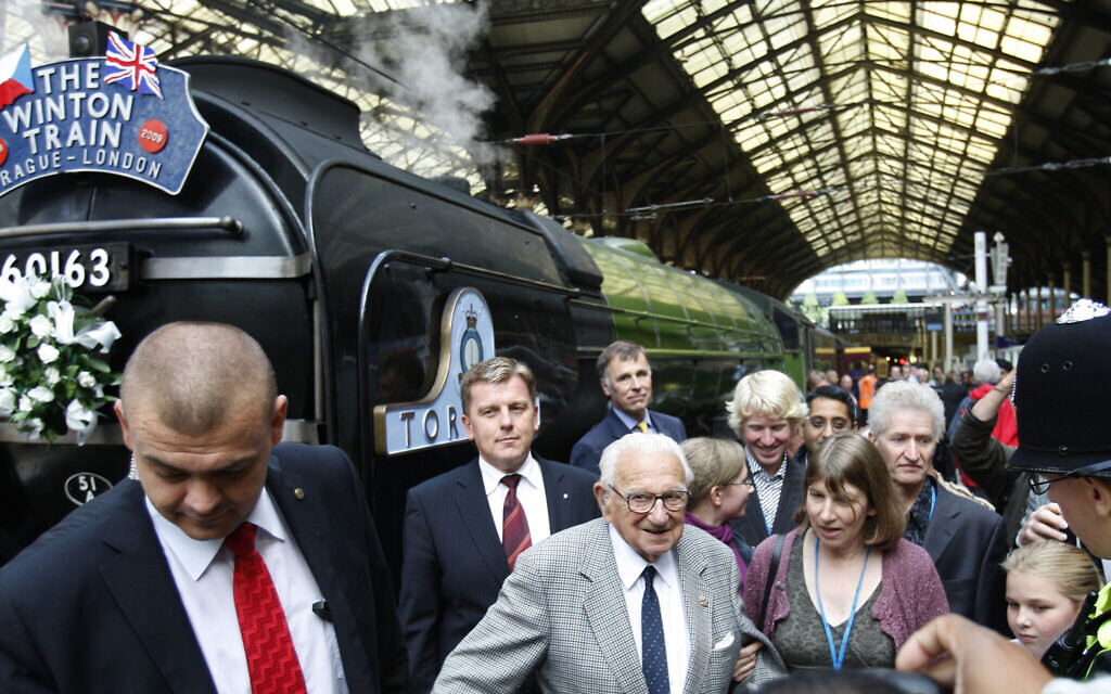 Nicholas Winton, center, at Liverpool Street station in London, September 4, 2009. (AP Photo/Kirsty Wigglesworth)