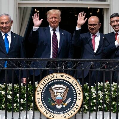 (L-R) Prime Minister Benjamin Netanyahu, US President Donald Trump, Bahraino Foreign Minister Khalid bin Ahmed Al Khalifa and United Arab Emirates Foreign Minister Abdullah bin Zayed al-Nahyan pose for a photo on the Blue Room Balcony after signing the Abraham Accords during a ceremony on the South Lawn of the White House in Washington, September 15, 2020. (AP Photo/Alex Brandon, File)