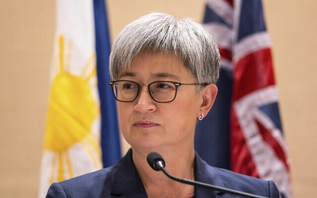 Australian Foreign Minister Penny Wong listens beside Philippine Foreign Affairs Secretary Enrique Manalo during a joint press conference at a hotel in Makati City, Philippines on Thursday May 18, 2023. (Lisa Marie David/Pool Photo via AP)