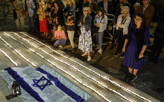 Members of the Jewish community light candles outside the synagogue in Strasbourg, France, October 11, 2023, four days after Hamas terrorists launched an unprecedented, multi-front massacre on Israel which killed over 1,200 people. (AP Photo/Jean-Francois Badias) Members of the Jewish community light candles outside the synagogue in Strasbourg, France, October 11, 2023, four days after Hamas terrorists launched an unprecedented, multi-front massacre on Israel which killed over 1,200 people. (AP Photo/Jean-Francois Badias)