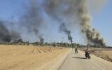 Hamas terrorists near Kibbutz Nir Oz during the massacre on October 7, 2023. (AP Photo/Hassan Eslaiah)