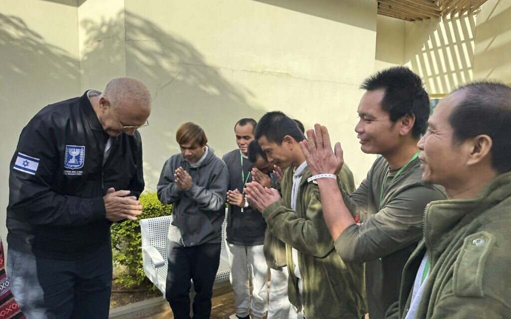 Israel's Prime Minister’s Office Director Gen. Yossi Shelley, left, visits together with Thai Ambassador to Israel Pannabha Chandraramya (not pictured) the special area at the Shamir Medical Center for the 14 Thai nationals and one Philippine national, who returned from the Gaza Strip after being abducted by Hamas terrorists, in Be'er Yaakov, Israel, November, 26, 2023. (Israel Prime Minister Office via AP)