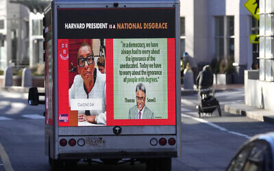 A truck with electronic panels calling attention to a recent controversy involving testimony to Congress by presidents of three prestigious schools drives along a street on December 12, 2023, near Harvard University, in Cambridge, Massachusetts. (AP Photo/Steven Senne)